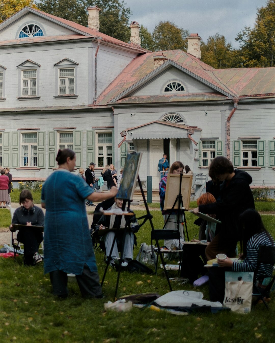 Senior people painting together at an art workshop
