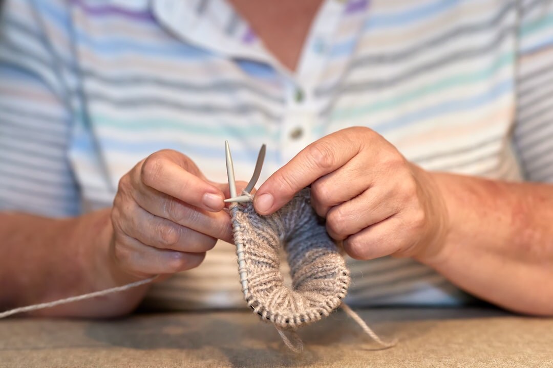 elderly woman knitting